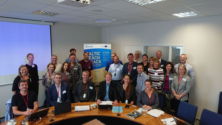 A group od people at conference in an office.