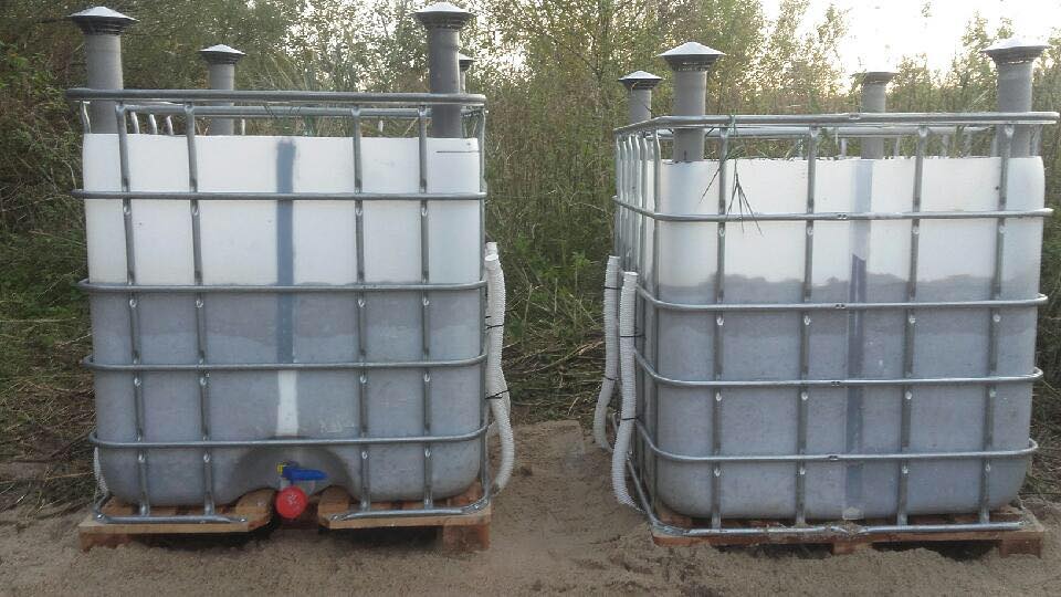 74615525_2794683903909924_8757340807901478912_n Two plastic tanks in metal cages on the outside.