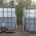 Two plastic tanks in metal cages on the outside.